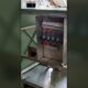 Stainless steel composter frame with the electrical control panel open, showing MCBs, contactors and wiring during fabrication at the TGMC workshop