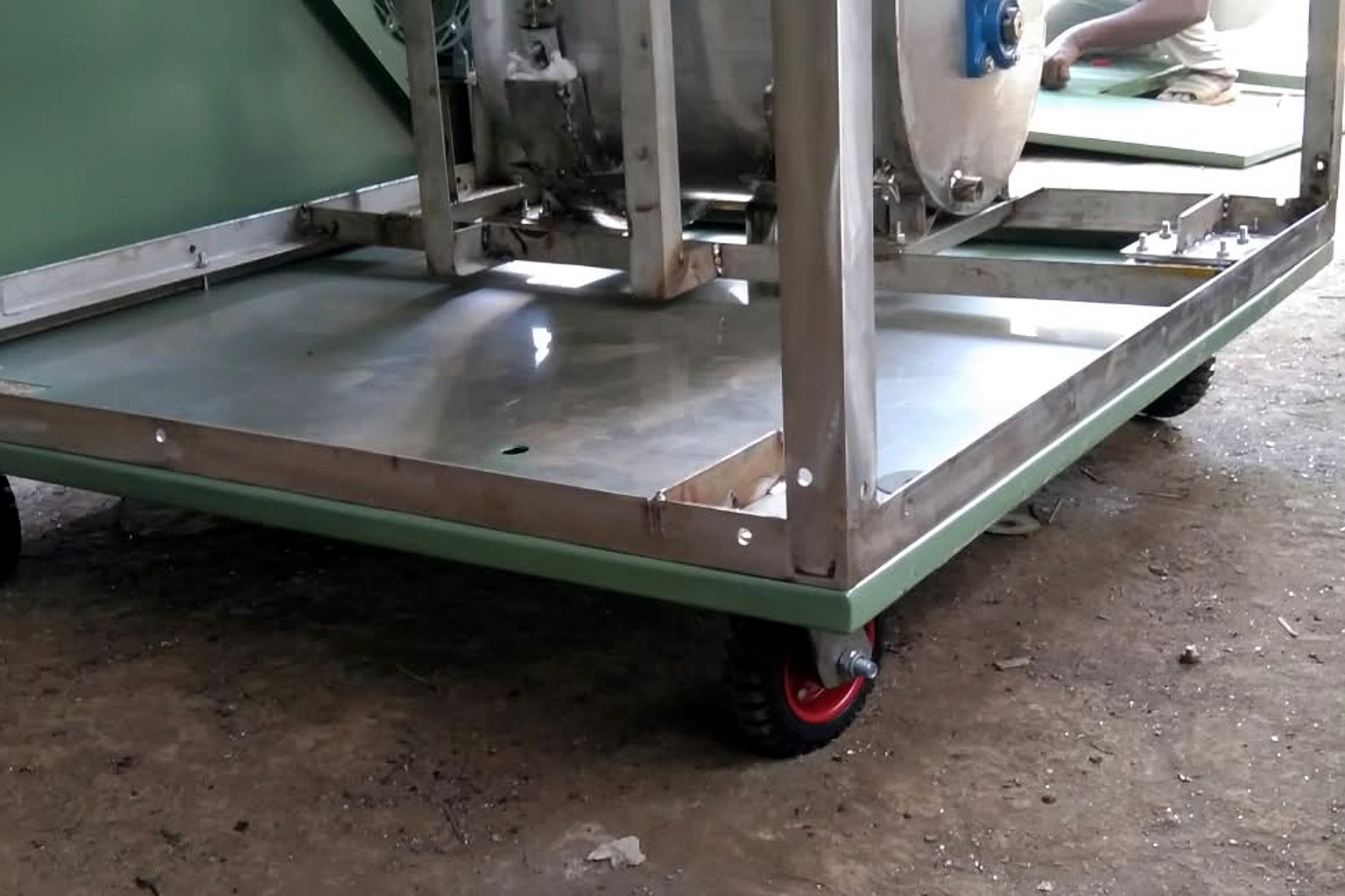 Stainless steel composter base frame with SS sheet floor on castor wheels, under fabrication at the TGMC workshop
